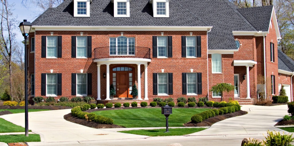 A brick home located in exclusive neighborhood