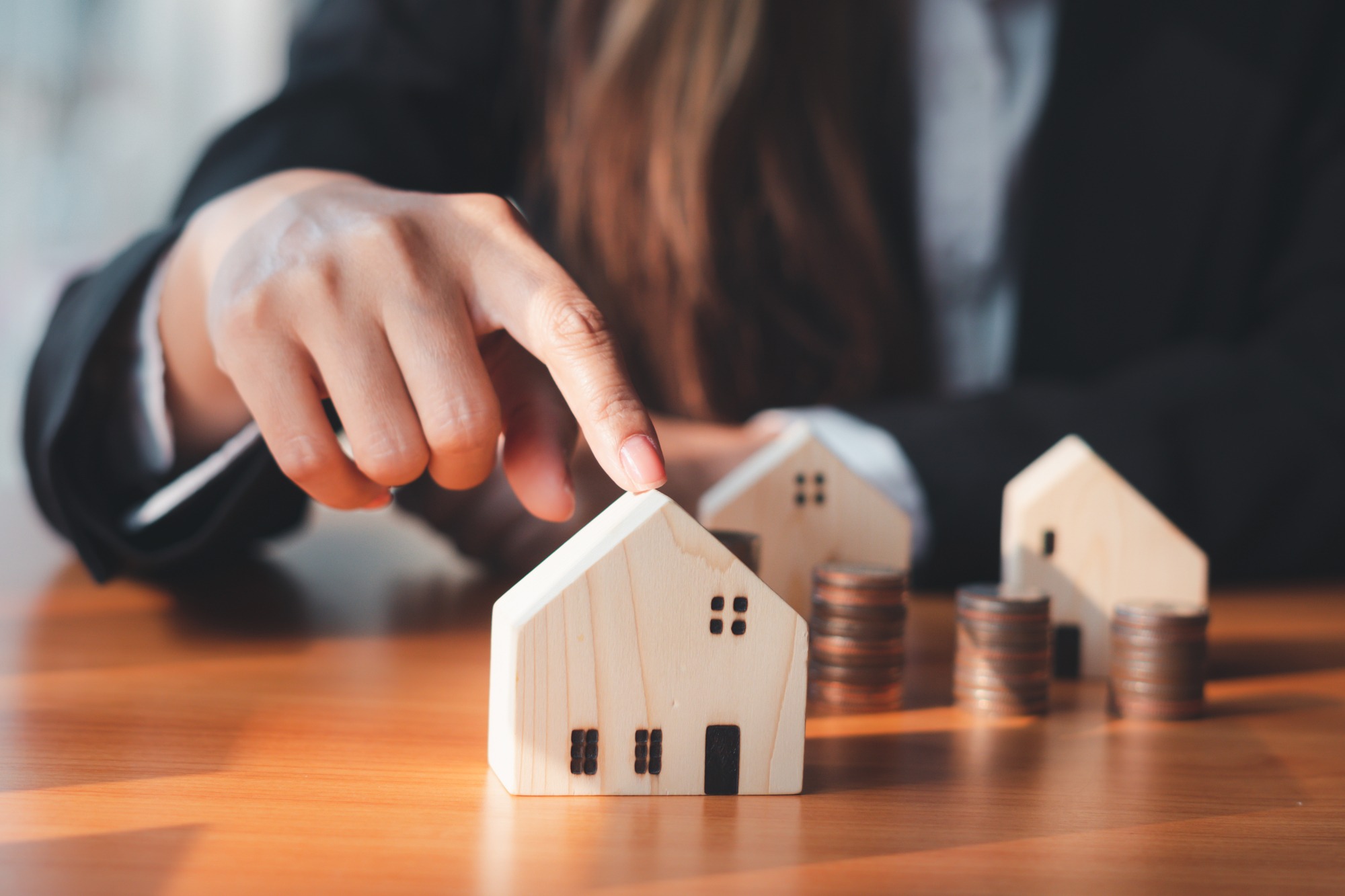 A house model being pointed at