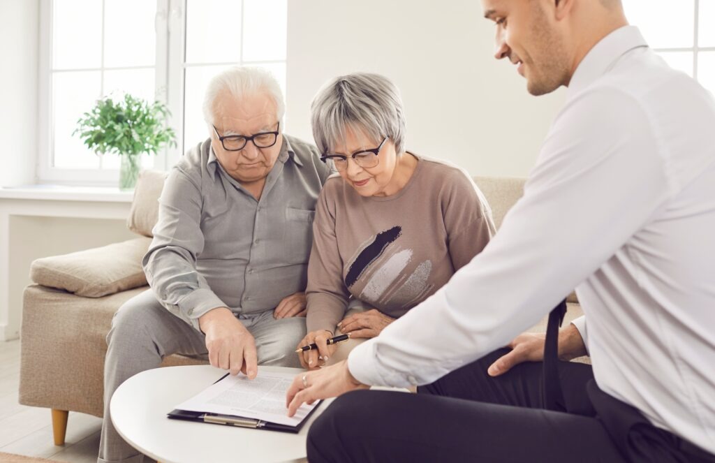 Senior pair and young consultant providing care